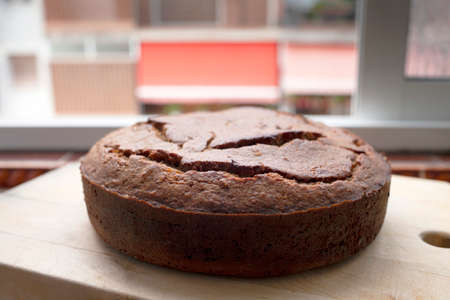 Homemade banana bread on wooden background. Home made bakery. Banana cake. Round, side viewの写真素材