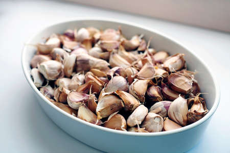 Garlic cloves with clipping path. White background.の写真素材