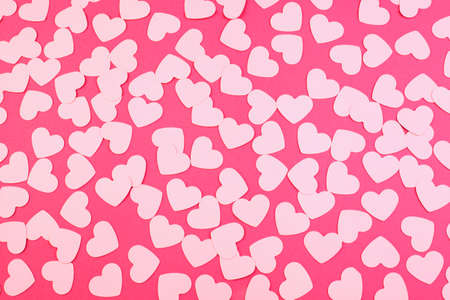 Hearts shaped made of paper on a pink background. Top view. Valentine's day or wedding. Love and romance concept.の写真素材