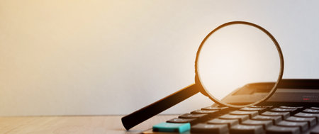 Electronic calculator with magnifier. Business accessories. Business economics, calculator, desktop.の写真素材