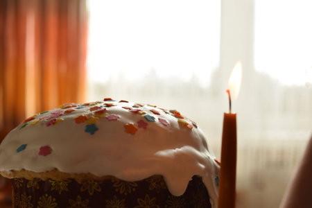 A notebook with the words hello spring on a light table, along with a branch of cotton and a clock. Natural light. Festive concept. Top view, flat lay. Spring theme.の写真素材