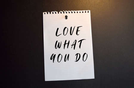 A sticky note attached to a decorative grocery cart along with small packaged letterboxes. Lettering content has implications for shops, sales, and marketing. Side view on white isolated background.の写真素材