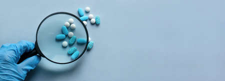 Basket with balls of thread. Gift boxes. Decorations for the holiday. Delicate colors, pink background.の写真素材