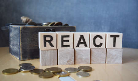 A young male doctor in blue medical gloves holds cubes with the inscription DONOR Health and medicine concept.の写真素材