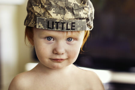 2 year old boy wearing Army ACU cap の写真素材