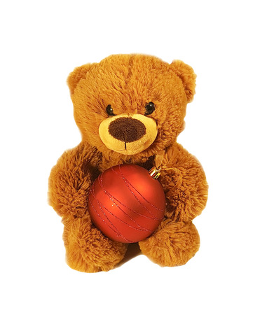 Toy teddy bear with red Christmas ballの写真素材