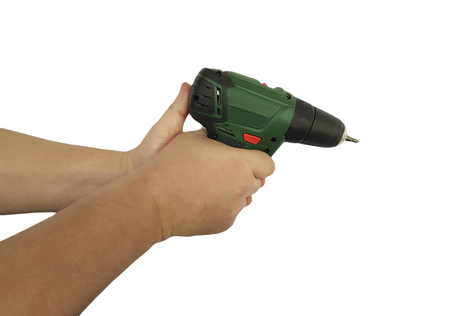 Man's hands holding drill, isolated on a white backgroundの写真素材