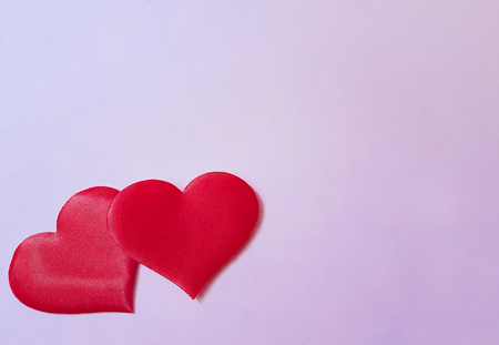 two red hearts on a backgroundの写真素材
