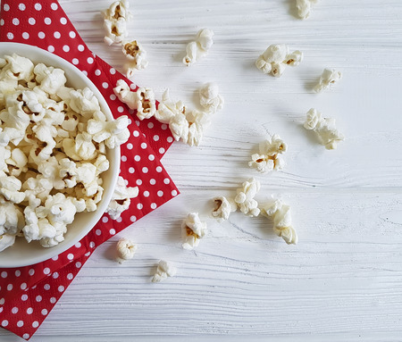 popcorn on white wooden, red napkinの写真素材