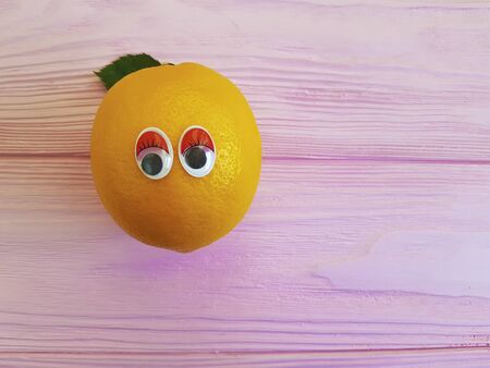lemon orange cartoon eyes woodenの写真素材