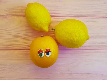lemon orange cartoon eyes woodenの写真素材