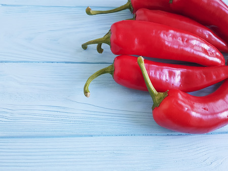 red pepper on blue woodenの写真素材