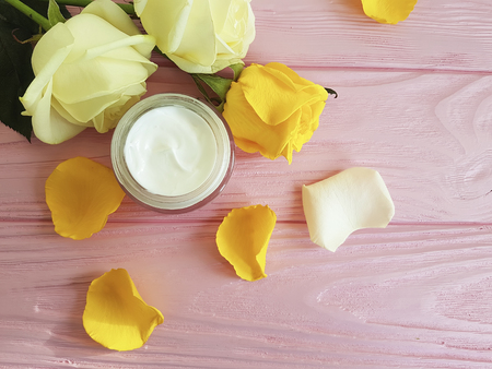 cosmetic cream, yellow rose on a pink wooden, cosmeticsの写真素材