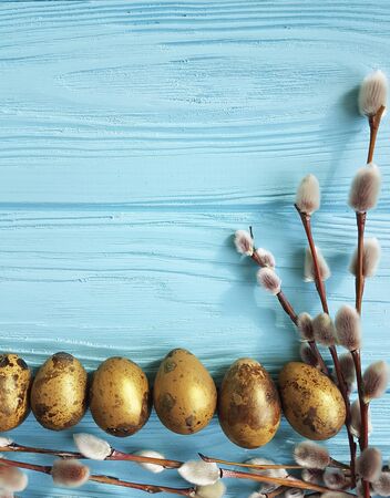 Easter quail eggs on white woodenの写真素材