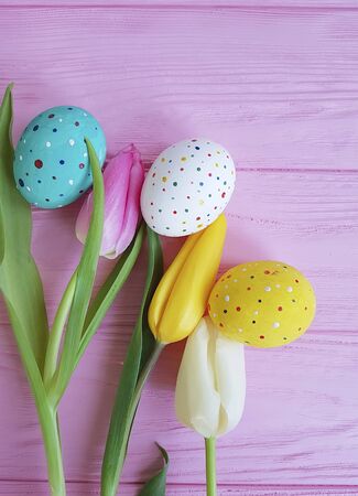 Easter eggs tulip flowers on woodenの写真素材