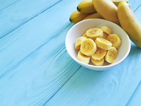 ripe banana plate piece on a blue wooden backgroundの写真素材