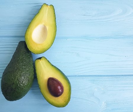 fresh avocado on blue woodenの写真素材