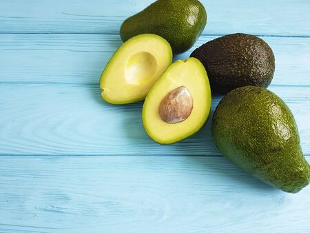 fresh avocado on blue wooden