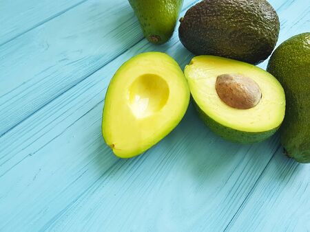 fresh avocado on blue wooden