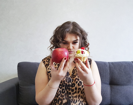 beautiful full girl curly hair apple and cake, sofaの写真素材