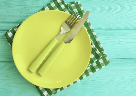 empty plate of a towel on a blue wooden backgroundの写真素材