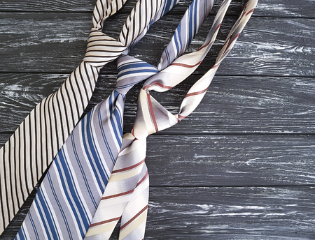 man's tie on an old black wooden background, happy father's dayの写真素材