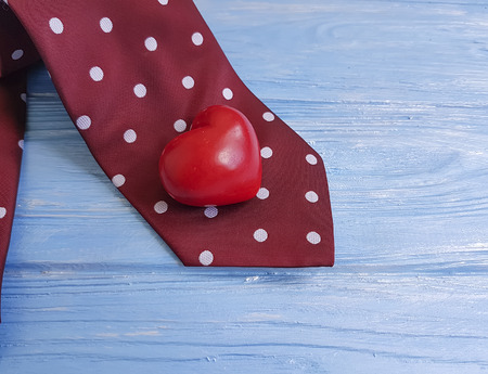 tie, heart, on a wooden retro backgroundの写真素材