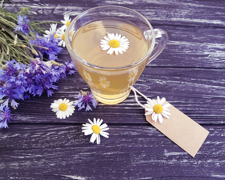 chamomile tea, cornflower on a wooden background, retroの写真素材