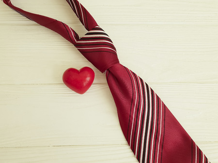tie heart on a wooden backgroundの写真素材