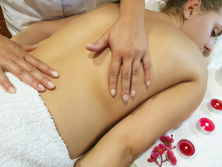 back massage girl salon spa procedureの写真素材