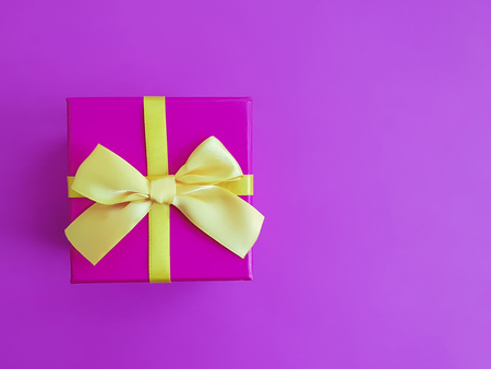 gift box on colored paper design boardの写真素材