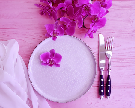 orchid flower plate on woodenの写真素材