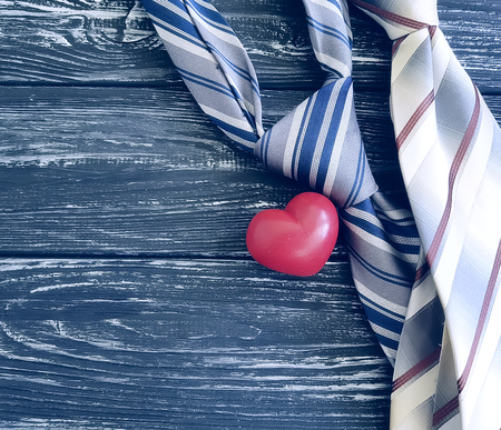 men's tie red heart on woodenの写真素材