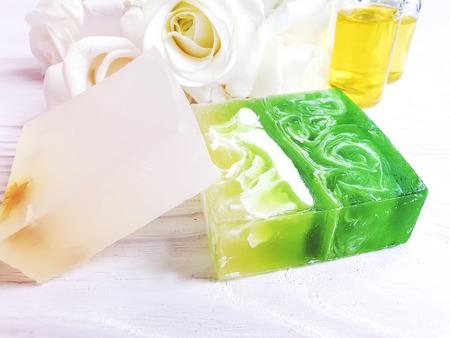 oil, soap, rose flower on wooden backgroundの写真素材