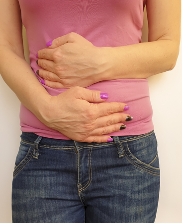 woman abdominal pain symptomの写真素材