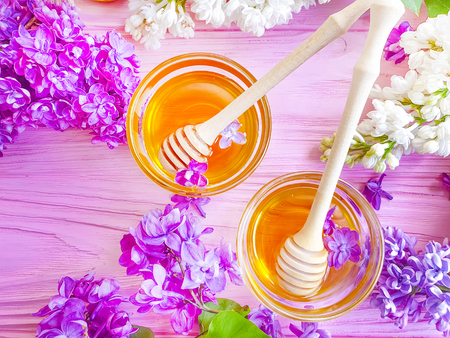 fresh honey lilac flower on wooden backgroundの写真素材