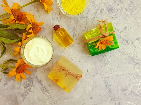 cosmetic cream and aromatherapy soap on concrete backgroundの写真素材