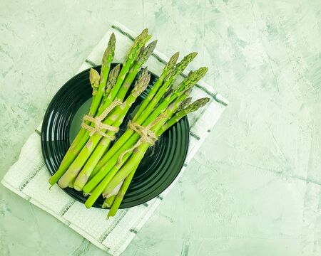 fresh asparagus on a plateの写真素材