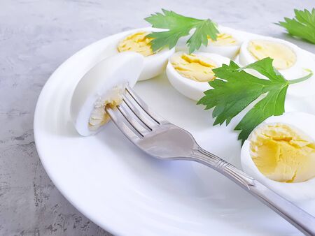 boiled eggs on a plate, parsley