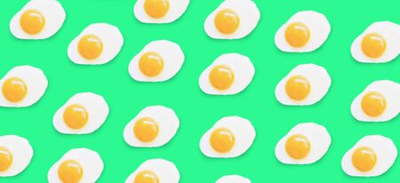 fried egg pattern on a coloredの写真素材