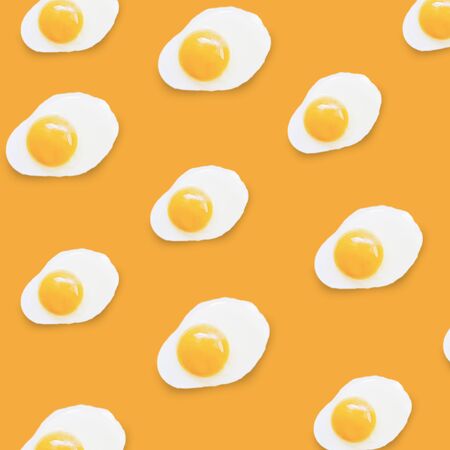 fried egg pattern on a coloredの写真素材
