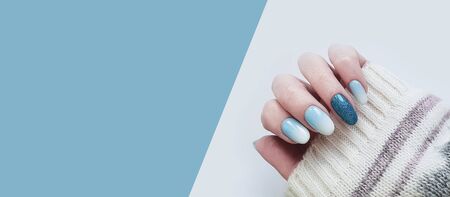 female hand beautiful manicure sweaterの写真素材