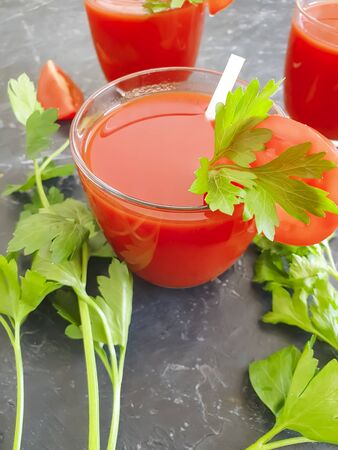parsley tomato juice on concreteの写真素材