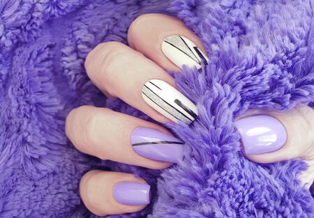 female hand nails beautiful manicure sweaterの写真素材
