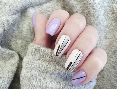 female hand nails beautiful manicure sweaterの写真素材