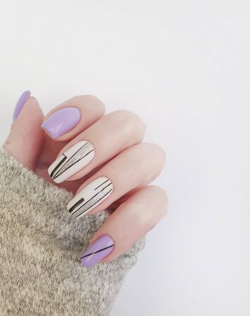 female hand nails beautiful manicure sweaterの写真素材