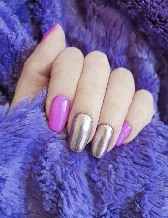 female hand nails beautiful manicure decorated colorの写真素材