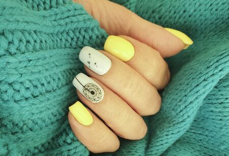 female hand nail beautiful manicure sweaterの写真素材