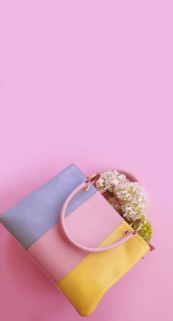 women bag, flowers on a colored backgroundの写真素材