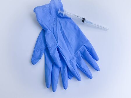 medical gloves, syringe on a white background